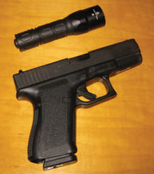 The author’s clearing tools of choice: Glock 19 9mm handgun and SureFire G2X Tactical light.